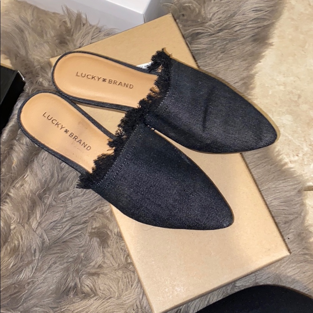 Black denim slides.